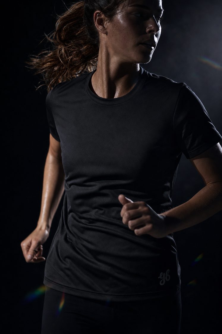 Woman running in the Yeah Buddy black shirt