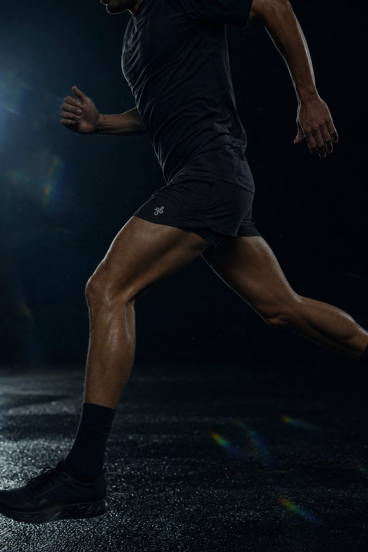 Man running in the Yeah Buddy black shorts