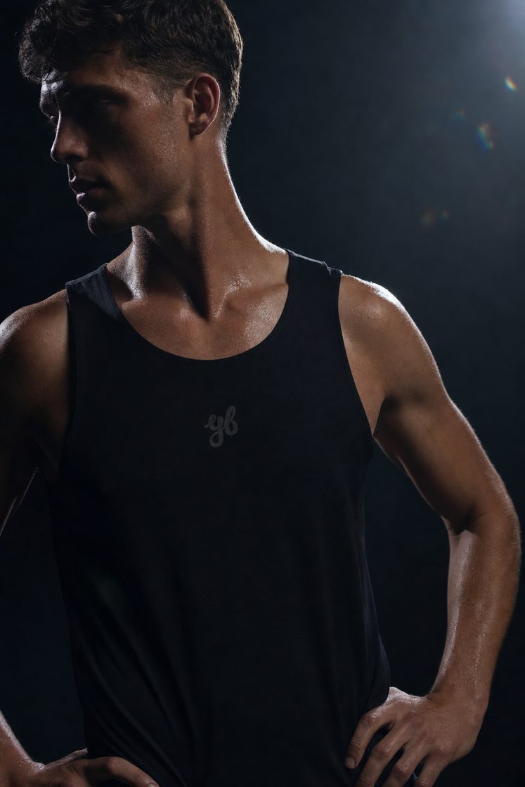 Man running in the Yeah Buddy black singlet